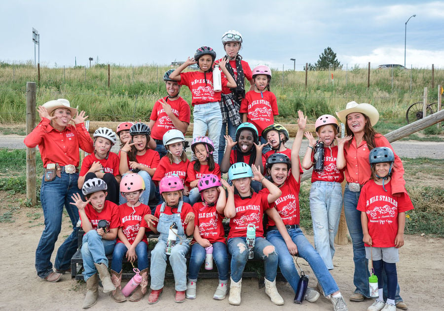 group photo of children and counselors making silly faces at 12 Mile Stables, sister camp of Big Horn Stables