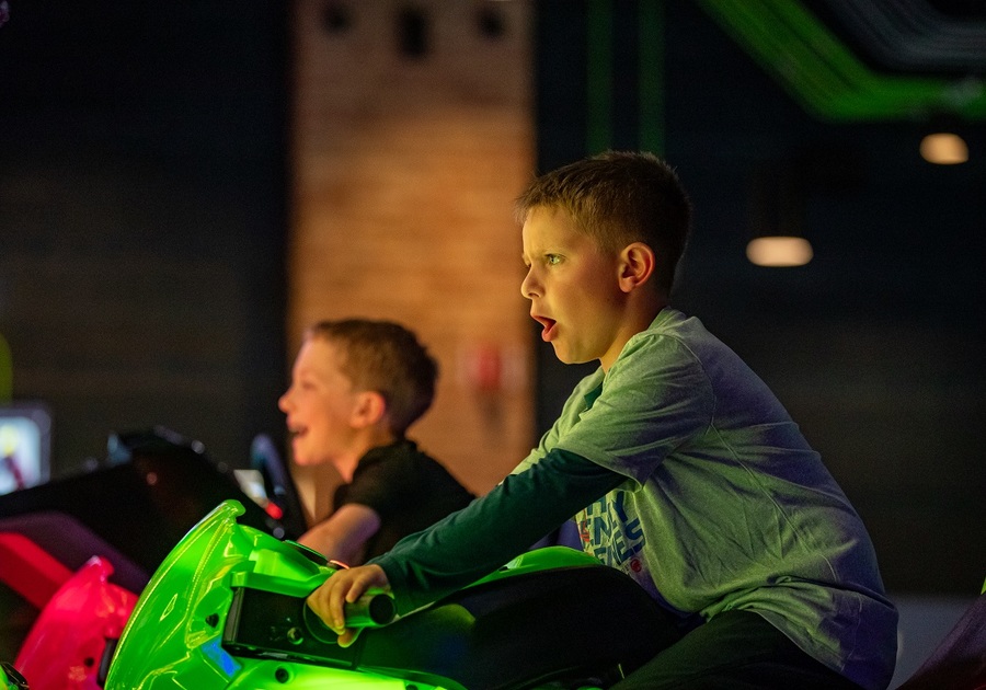 boy on motorcycle arcade game