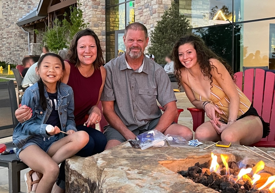 Gaylord Rockies. Family in front of fire pit at Gaylord Rockies