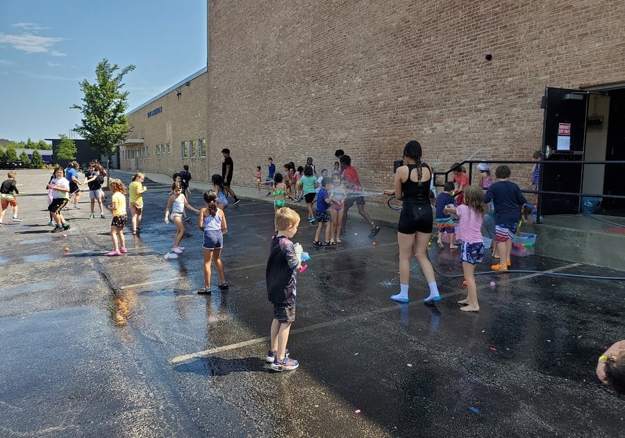 Campers having water fights