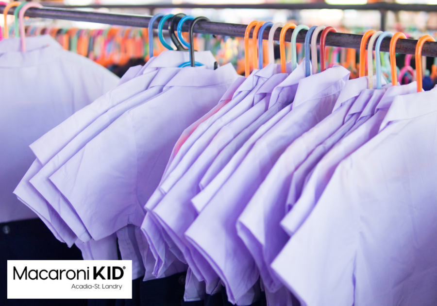 school uniforms on a clothing rack