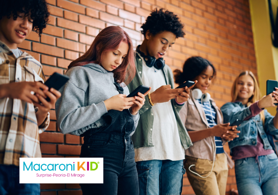 A group of high school students each texting from their phones