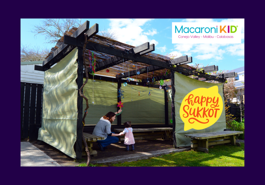 Happy Sukkot, a mother and child in a Sukkah, a temporary outdoor structure