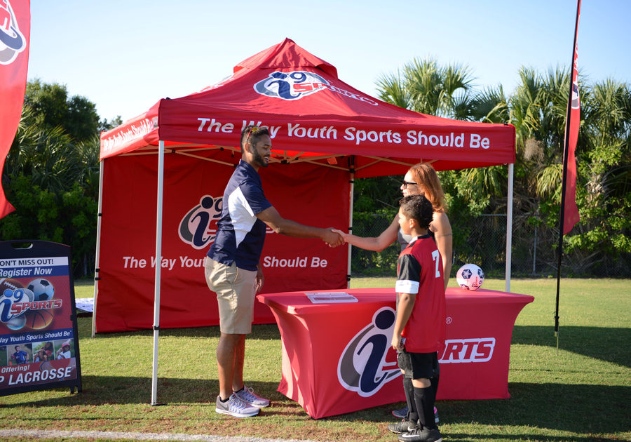 i9 Sports Staff and i9 Sports Parent shaking hands