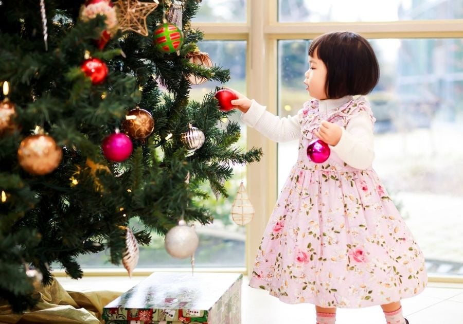 little girl and Christmas tree