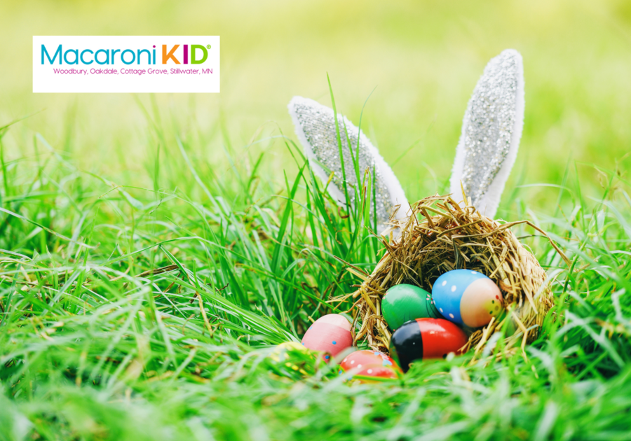 Easter eggs in a small basket on green grass