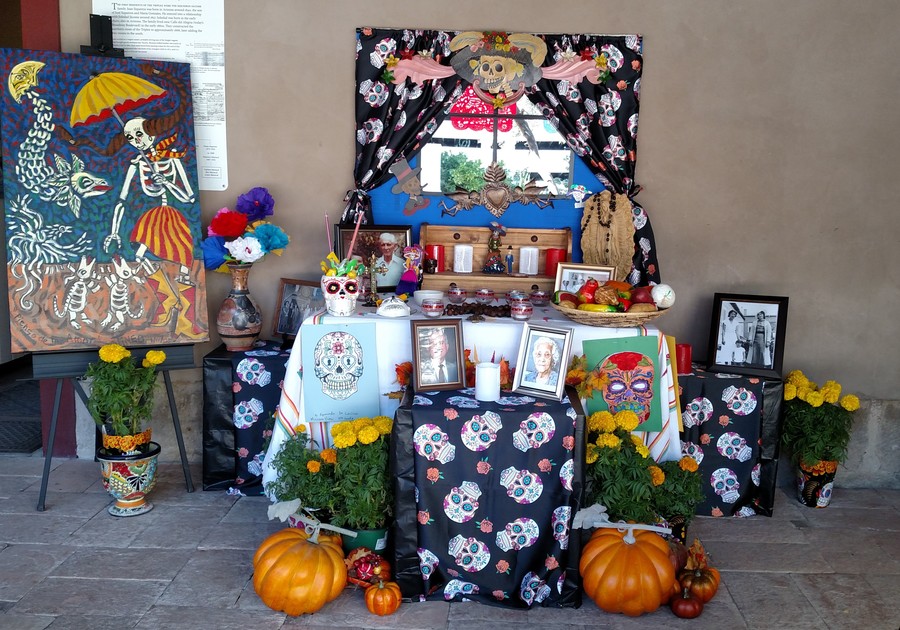 Alter decorated with sugar skulls and marigolds at Presidio Museum