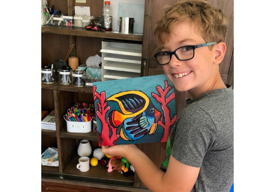 boy with painting of fish