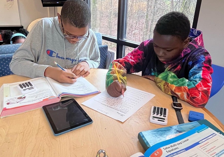 2 boys working on math homework