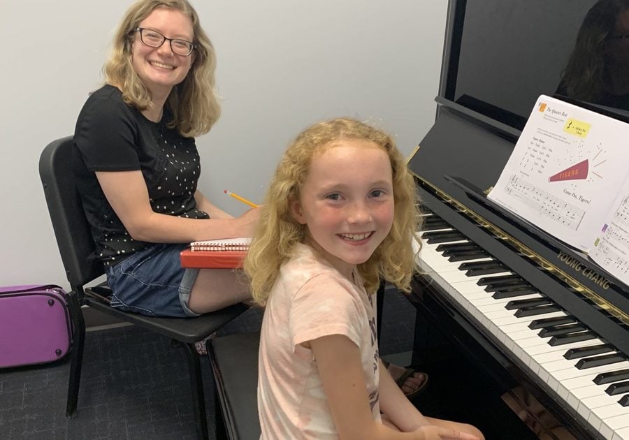 Teacher and student at piano at Valotta Studios
