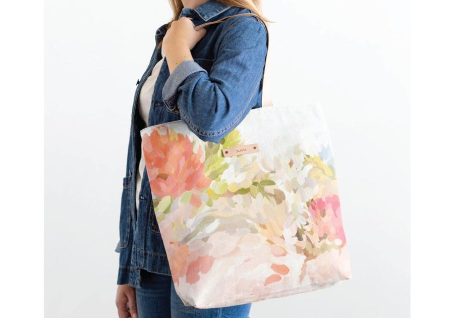 Lady holding tote by Minted
