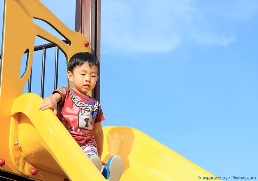 cute child on slide at playground