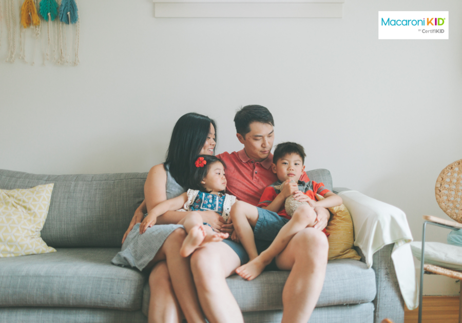 asian american family sitting on a couch