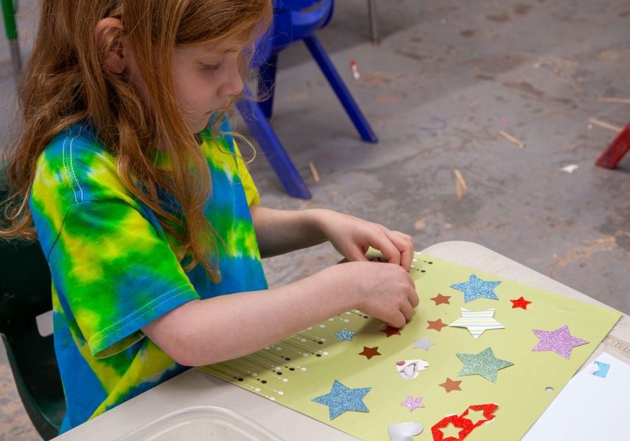 young girl doing art work