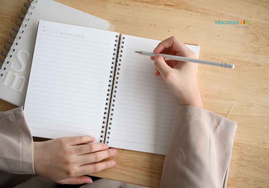 woman writing in notebook