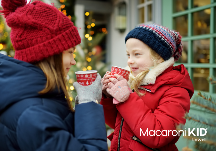 Girls drinking cocoa outdoors winter